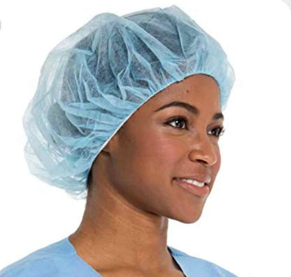 Disposable blue bouffant cap worn by dental professional